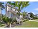 Charming two-story home featuring a welcoming front porch, manicured lawn, and mature landscaping at 2636 Colonel Harrison Dr, Johns Island, SC 29455