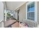 Inviting front porch with rocking chairs, a bench, and a decorative wreath on the front door at 2636 Colonel Harrison Dr, Johns Island, SC 29455