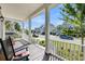 Inviting front porch with rocking chairs and a beautiful view of the neighborhood at 2636 Colonel Harrison Dr, Johns Island, SC 29455