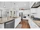 Well-lit kitchen with stainless steel appliances, granite counters, and ample cabinet space at 2636 Colonel Harrison Dr, Johns Island, SC 29455
