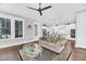 Comfortable living room featuring hardwood floors, ample natural light, and an open layout at 2636 Colonel Harrison Dr, Johns Island, SC 29455