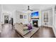 Inviting living room with a cozy fireplace, hardwood floors, and neutral décor at 2636 Colonel Harrison Dr, Johns Island, SC 29455