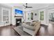 Cozy living room with a fireplace, hardwood floors, and access to the outdoor deck at 2636 Colonel Harrison Dr, Johns Island, SC 29455