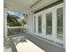 Charming covered balcony with French doors, blending indoor comfort with outdoor scenery at 30 Yacht Harbor Ct, Isle of Palms, SC 29451