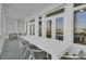 Expansive covered balcony features a large dining table, perfect for outdoor entertaining with marina views at 30 Yacht Harbor Ct, Isle of Palms, SC 29451