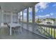 Inviting screened-in balcony offering relaxing marina views and a cooling ceiling fan at 30 Yacht Harbor Ct, Isle of Palms, SC 29451