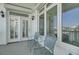Cozy balcony featuring two comfortable chairs, providing an ideal space to relax and unwind at 30 Yacht Harbor Ct, Isle of Palms, SC 29451