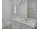 Well-lit bathroom featuring a white vanity with gold hardware, and a glass-enclosed shower at 30 Yacht Harbor Ct, Isle of Palms, SC 29451