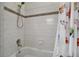 A full bathroom featuring a bathtub, shower head and butterfly-themed shower curtain and tile accent at 30 Yacht Harbor Ct, Isle of Palms, SC 29451