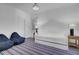 A bright bedroom featuring a twin bed, beanbag chairs, and a striped rug at 30 Yacht Harbor Ct, Isle of Palms, SC 29451