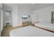 Bright bedroom featuring a large window, a TV, and twin beds at 30 Yacht Harbor Ct, Isle of Palms, SC 29451