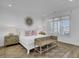 Bright bedroom features a white bedframe with accent pillows, lamps, and an area rug at 30 Yacht Harbor Ct, Isle of Palms, SC 29451
