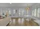 Bright dining room with views of the water, modern chairs, and access to the patio at 30 Yacht Harbor Ct, Isle of Palms, SC 29451