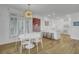 Open-concept kitchen and dining area with white cabinetry and ample counter space at 30 Yacht Harbor Ct, Isle of Palms, SC 29451