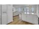 Open-concept kitchen featuring stainless steel appliances and access to the living room and waterfront views at 30 Yacht Harbor Ct, Isle of Palms, SC 29451