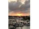 Picturesque sunset view of the marina showcasing various boats docked along the calm waters at 30 Yacht Harbor Ct, Isle of Palms, SC 29451