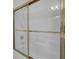Bright shower featuring gold trim sliding doors and a handheld shower head with a white shower tub at 30 Yacht Harbor Ct, Isle of Palms, SC 29451