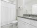 Clean bathroom with a shower curtain, granite-style counters, white cabinets, and tile floors at 3061 Cross Vine Ln, Summerville, SC 29483
