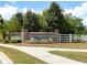 Community entrance with brick signage and landscaped features, creating a welcoming first impression at 3061 Cross Vine Ln, Summerville, SC 29483