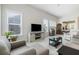 Inviting living space filled with natural light, comfortable furniture, and a view into the kitchen at 3061 Cross Vine Ln, Summerville, SC 29483