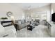 Bright living room with lots of windows, and comfortable furniture. A ceiling fan provides pleasant airflow at 3061 Cross Vine Ln, Summerville, SC 29483
