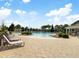Resort-style pool with sun loungers and seating, perfect for relaxing and enjoying the outdoors at 3061 Cross Vine Ln, Summerville, SC 29483