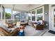 Relaxing screened porch features comfortable seating, perfect for enjoying the outdoors at 3061 Cross Vine Ln, Summerville, SC 29483