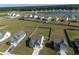 Aerial view of neighborhood with large lots and a lake in the distance at 312 Cypress Branch Rd, Huger, SC 29450