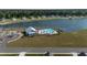 Aerial view of community pool with lounge chairs and a lakeside view at 312 Cypress Branch Rd, Huger, SC 29450