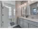 Bathroom features a double vanity with modern fixtures, a walk-in shower and a separate toilet area at 312 Cypress Branch Rd, Huger, SC 29450