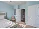 Comfortable bedroom features neutral carpeting, modern lighting, and a doorway leading to other rooms at 312 Cypress Branch Rd, Huger, SC 29450