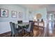 Cozy dining area with seating for four, hardwood floors, and bright natural light at 312 Cypress Branch Rd, Huger, SC 29450