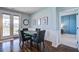 Dining area with access to outdoor space, hardwood floors, and stylish wall art at 312 Cypress Branch Rd, Huger, SC 29450