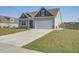 This attractive, single Gathering home features a well-manicured lawn at 312 Cypress Branch Rd, Huger, SC 29450