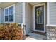 Inviting front entrance with decorative wreath and manicured landscaping at 312 Cypress Branch Rd, Huger, SC 29450