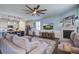 Bright and open living space with a fireplace, large sectional, and a kitchen view at 312 Cypress Branch Rd, Huger, SC 29450