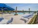 Resort-style community pool with comfortable lounge chairs and stunning lake views in a desirable neighborhood at 312 Cypress Branch Rd, Huger, SC 29450