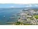 Gorgeous aerial view of the condo and harbor with docks, sailboats, and a cruise ship docked nearby at 330 Concord St # 4A, Charleston, SC 29401