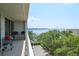 Balcony with two chairs and outdoor grill overlooking the harbor and marina at 330 Concord St # 4A, Charleston, SC 29401
