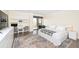 Bright bedroom featuring a bed, desk and shelving unit, with an outdoor patio at 330 Concord St # 4A, Charleston, SC 29401
