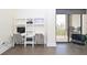 Bedroom desk area with two chairs and outdoor patio with seating and concrete floors at 330 Concord St # 4A, Charleston, SC 29401