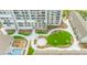 Beautiful courtyard with lush grass, trees, walkways, and seating, providing a relaxing outdoor space for residents at 330 Concord St # 4A, Charleston, SC 29401