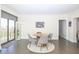 Stylish dining area with a round table, seating for four, and balcony access at 330 Concord St # 4A, Charleston, SC 29401