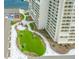 Exterior view of a high rise condo building surrounded by manicured green spaces at 330 Concord St # 4A, Charleston, SC 29401