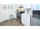 Modern kitchen with stainless steel oven and refrigerator, white cabinets, and concrete flooring at 330 Concord St # 4A, Charleston, SC 29401