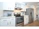 Well-equipped kitchen with stainless steel appliances, white cabinets, and ample counter space at 330 Concord St # 4A, Charleston, SC 29401