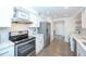 Bright kitchen featuring stainless steel appliances, white cabinets, and modern countertops at 330 Concord St # 4A, Charleston, SC 29401