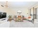 Bright living room with modern furnishings and a large sliding glass door to balcony at 330 Concord St # 4A, Charleston, SC 29401