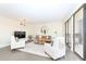 Bright living room featuring modern furniture, decor and a balcony with sliding glass doors at 330 Concord St # 4A, Charleston, SC 29401