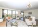 Open-concept living area with stylish furniture, a dining area, and balcony access at 330 Concord St # 4A, Charleston, SC 29401